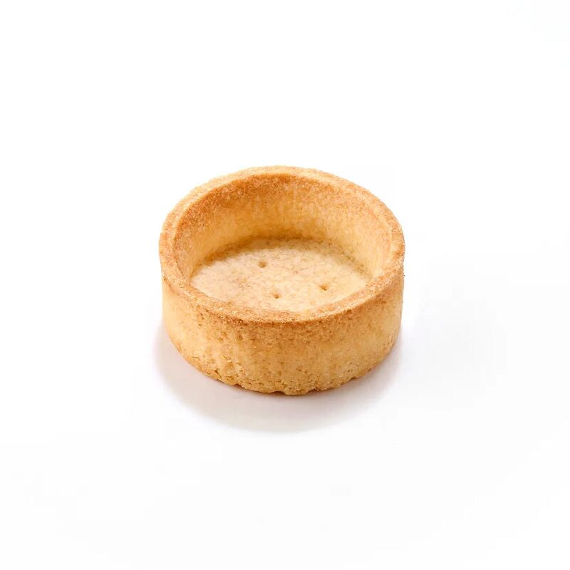A miniature round pastry tart shell or cookie cup, golden brown and textured, shown on a clean white background 
