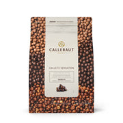Cocoa pearls with shiny marbled chocolate coating
